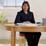 Photo: teacher at desk in classroom